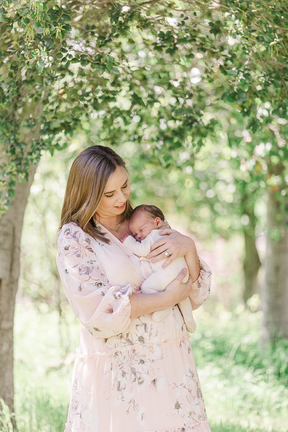Newborn photos outside by tree
