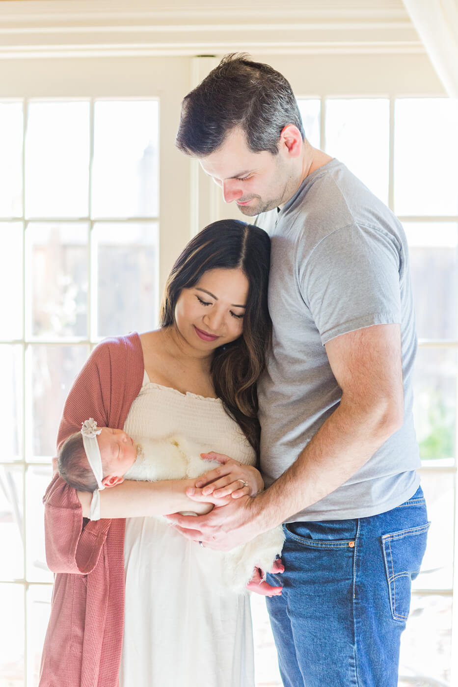Bay Area Newborn Photography of couple holding baby