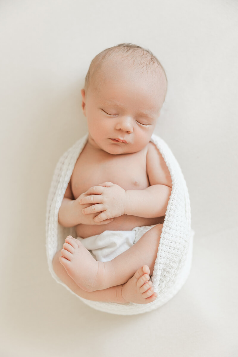 baby boy sleeping during a newborn photography session in the San Francisco Bay Area