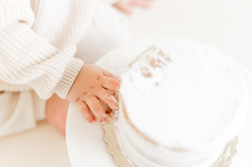 baby boy touching cake by bay area cake smash photographer